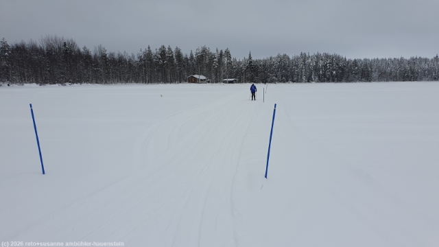 loipe posionjaerven aurinkolatu ueber den posionjaervi bei posio